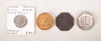 Two medals and a coin.