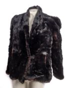 An early 20th century gentleman's black wool three piece suit , comprising tail coat,