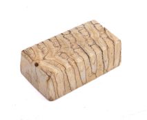 A carved mammoth's tooth paperweight.