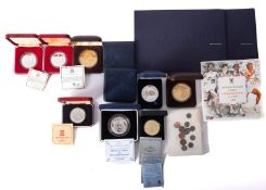 A collection of silver coins and medallions, including 1986 Royal Wedding,