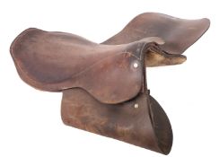 Two early 20th century brown leather saddles,