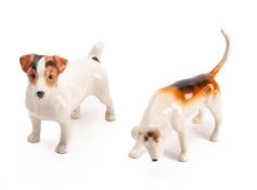 Two Beswick ceramic figures of dogs. Comprising a Hound and a Terrier.