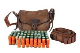 A collection of 12 bore paper cartridges, mostly Eley with various retailers to cases,