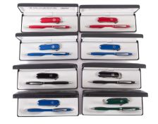 A collection of eight Cross Victorinox cased sets.