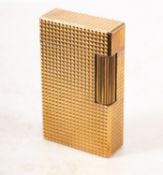WITHDRAWN A mid 20th century SJ Dupont, Paris gold plated lighter. Serial number 506DW, without box.