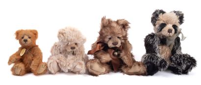 A collection of four Charlie Bear teddy bears.