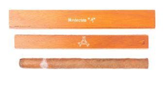 A Montecristo A hand made cigar in original wooden box. Complete with inner packaging, L23cm.