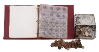 A collection of coins in an album and tin,