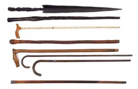 Two early 20th century silver mounted walking sticks,