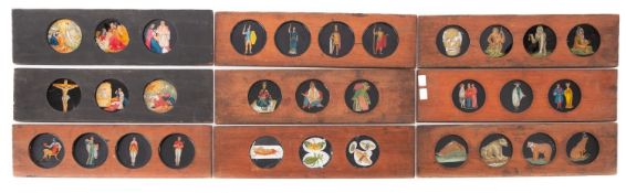 A mixed collection of hand painted magic lantern slides.