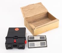 A Stereolist black Bakelite stereoscopic viewer, together with eight landscape slides.
