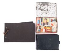 A collection of early to mid 20th century photographs in two albums.