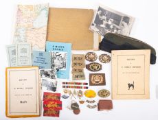 A collection of paper ephemera and badges relating to Sgt Phillip Waldren of the Devon Regiment.
