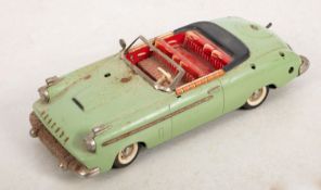A Schuco 5700 Syncromatic Packard, pale green with litho printed interior,