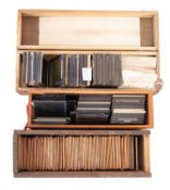 A collection of photographic magic lantern slides.