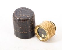 A 19th century gilt brass optical novelty spy glass, with reticule lens, unsigned,