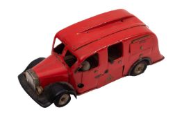 A Tri-ang Minic clockwork fire engine, red with black and silver trim,