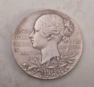 An 1897 larger silver medallion, approx 8.4g.