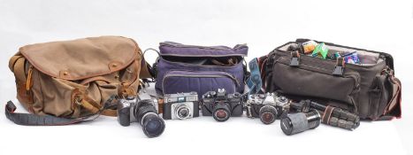 A mixed collection of cameras and accessories.