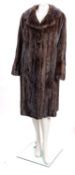 An early 20th century Debenham & Freebody full length fur coat,