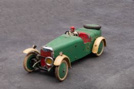 A Meccano Motor Car, in cream and green with red interior,