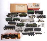 A mixed collection of OO/HO gauge steam locomotives and tenders.