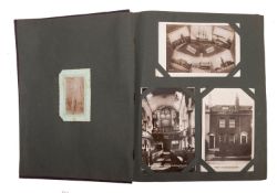 An Edwardian postcard album and contents.