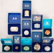 A collection of ten Halcyon Days enamel boxes.