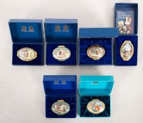 A collection of Halcyon Days Royal Legends enamel boxes.