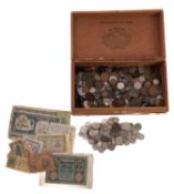 A cigar box containing mixed quantity of British and world coins including pre 1947 and banknotes.