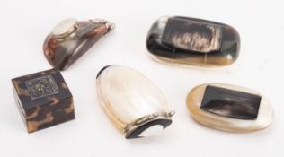 A collection of five snuff boxes.