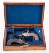 A pair of Burnie of Berwick flintlock pocket pistols. Having plain cylindrical 1.