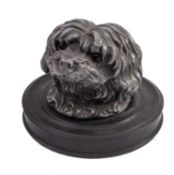 An inkwell in the form of a dog's head.