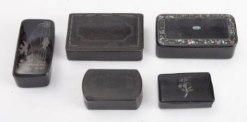 A collection of five ebonised snuff boxes.
