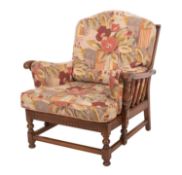 An elm and upholstered suite, by Ercol,
