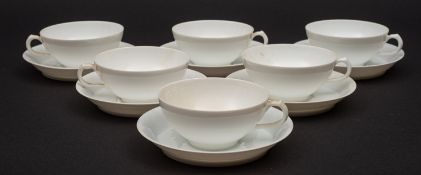 A set of French Limoge cups and saucers. In white having J.P.L stamped to the base, 20 cups approx.
