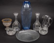 A pair of clear glass decanters and stop
