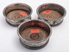 A set of three Sheffield Plate coasters