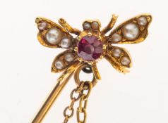 A ruby & seed pearl insect stick pin, th