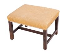 A mahogany and upholstered dressing tabl