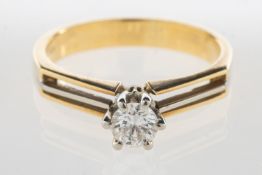 A modern bi-colour diamond ring, claw se