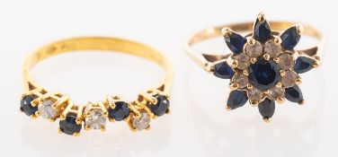 Two dark blue sapphire set rings, includ