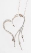 A heart pendant with chain, an openwork