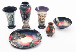 Six Moorcroft pottery vases. Including a
