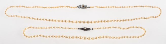 Ciro. A pearl necklace and a faux pearl