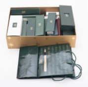 A collection of Pen boxes and holders. C