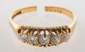 An antique five stone diamond ring, claw
