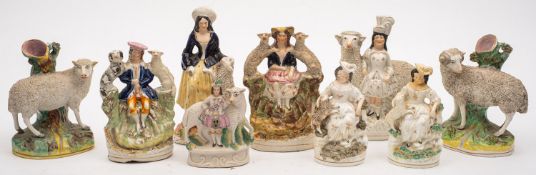 A collection of Staffordshire sheep related figure groups.
