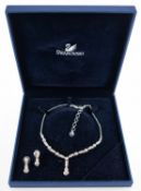 Swarovski. A necklace and earring set, a