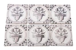 A collection of approximately fifty-five tiles,